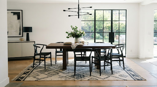 Modern dining area with a geometric Haus & Harbour rug